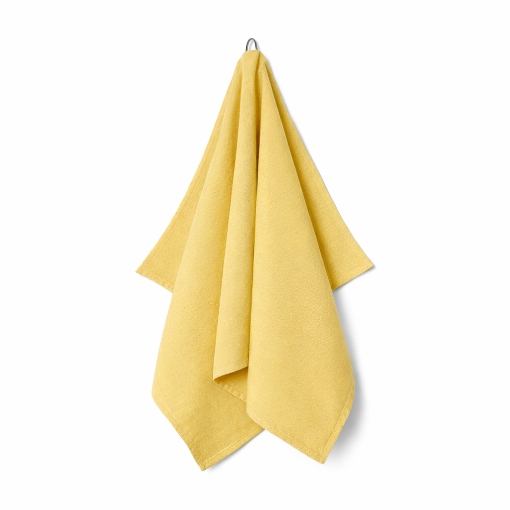 Yellow towel hanging on a white background