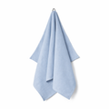 Light blue towel hanging on a white background