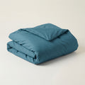 FoldedStone blue duvet on a beige background